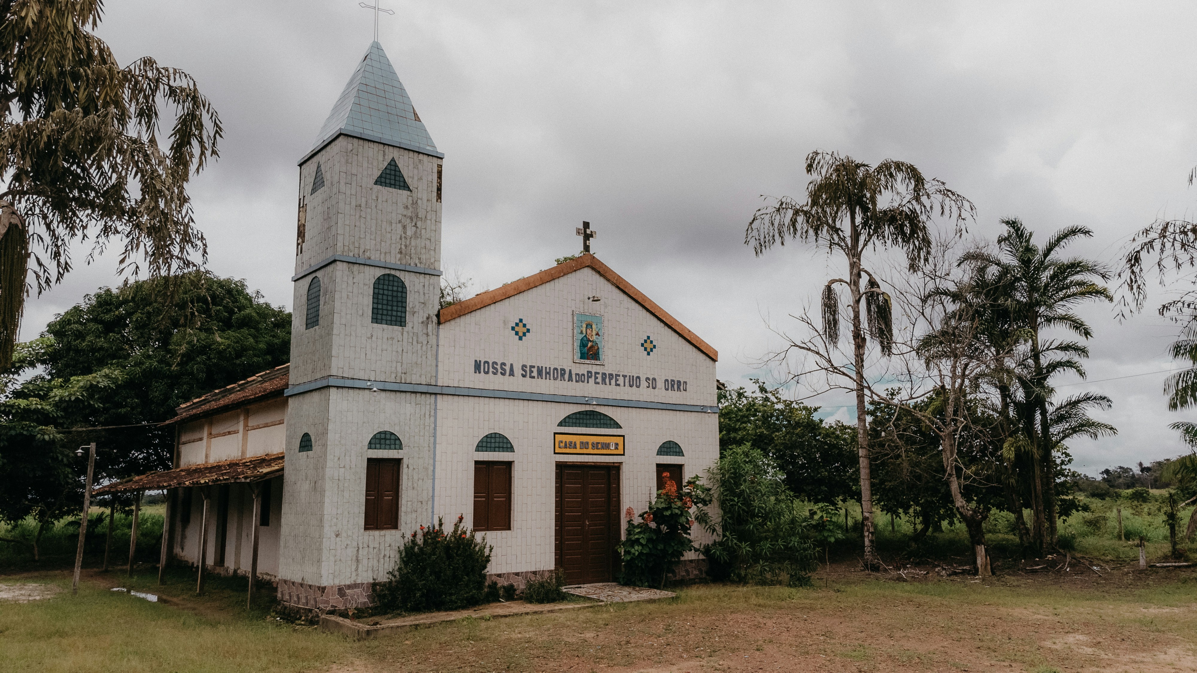 an old church with a steeple and a clock tower