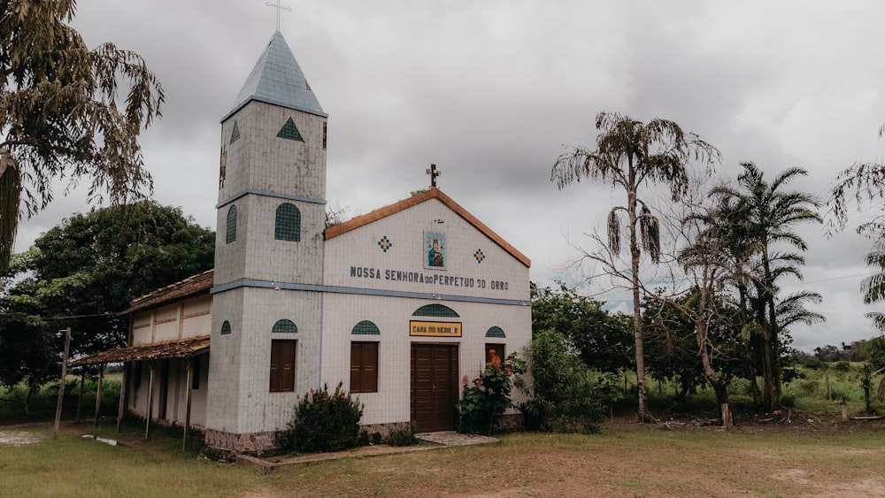 an old church with a steeple and a clock tower