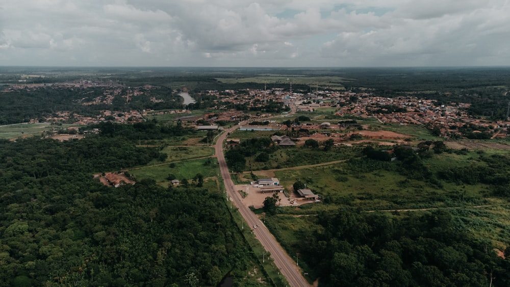 an aerial view of a town surrounded by trees