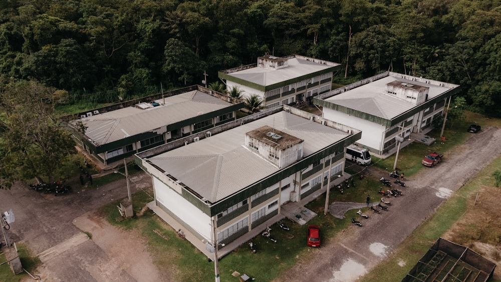 an aerial view of a building surrounded by trees