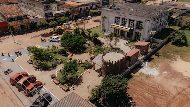 an aerial view of a town with a train on the tracks