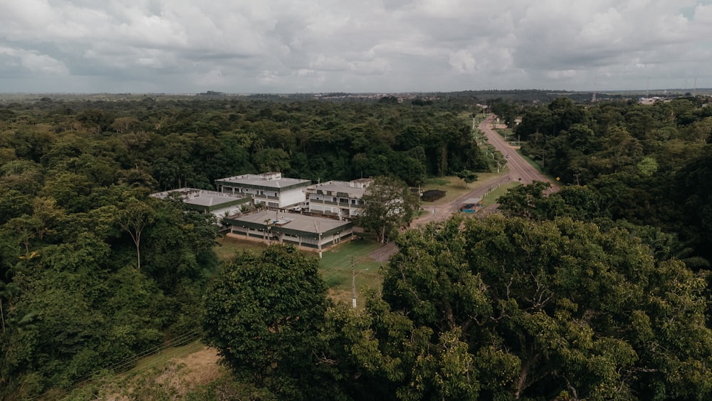 an aerial view of a house surrounded by trees