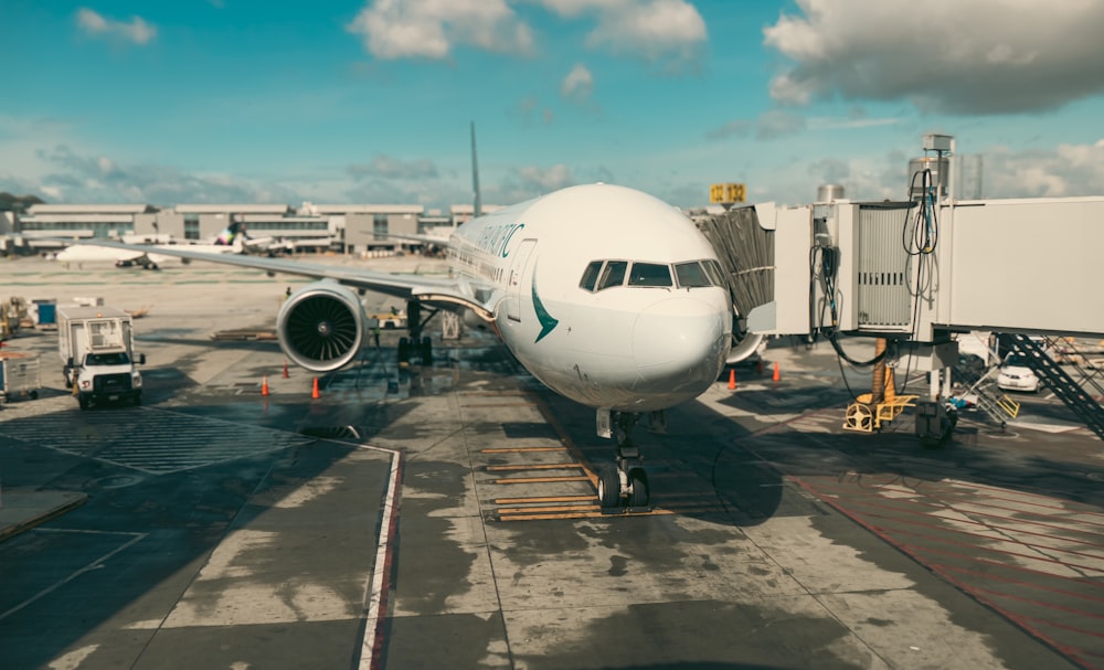 a large jetliner sitting on top of an airport tarmac