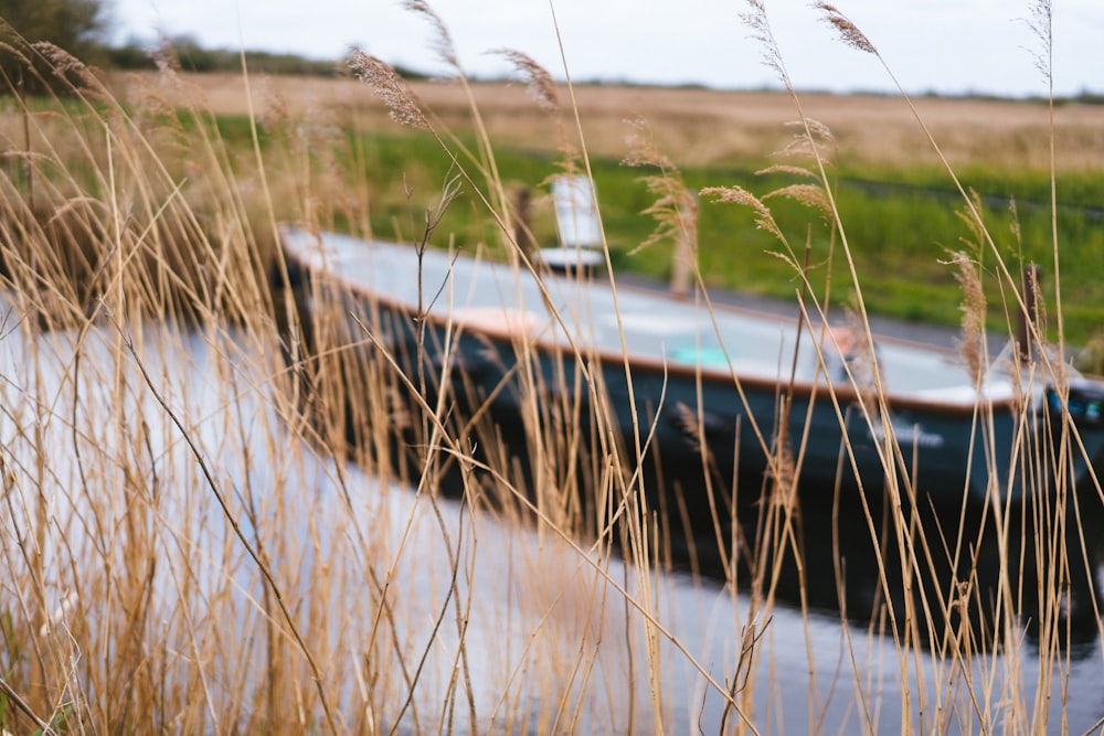 a small boat floating on top of a body of water