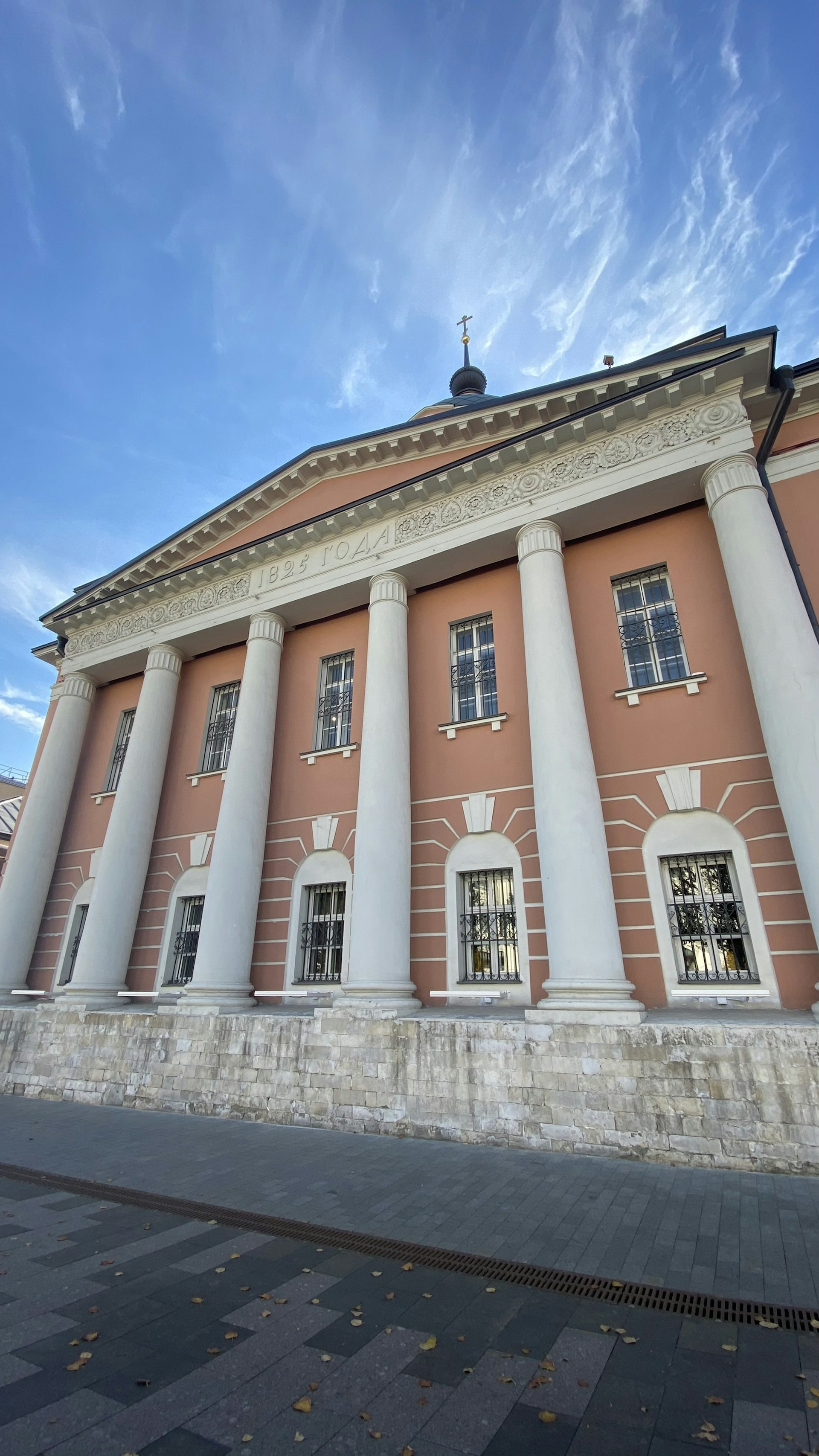 a large building with columns and a clock tower