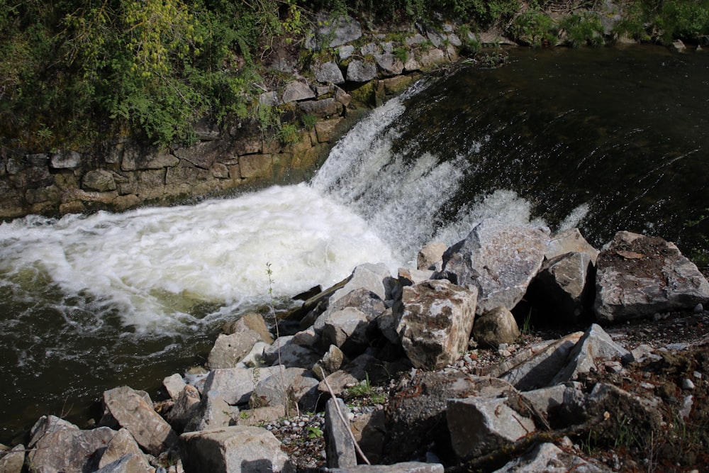 a river with rocks and water running over it