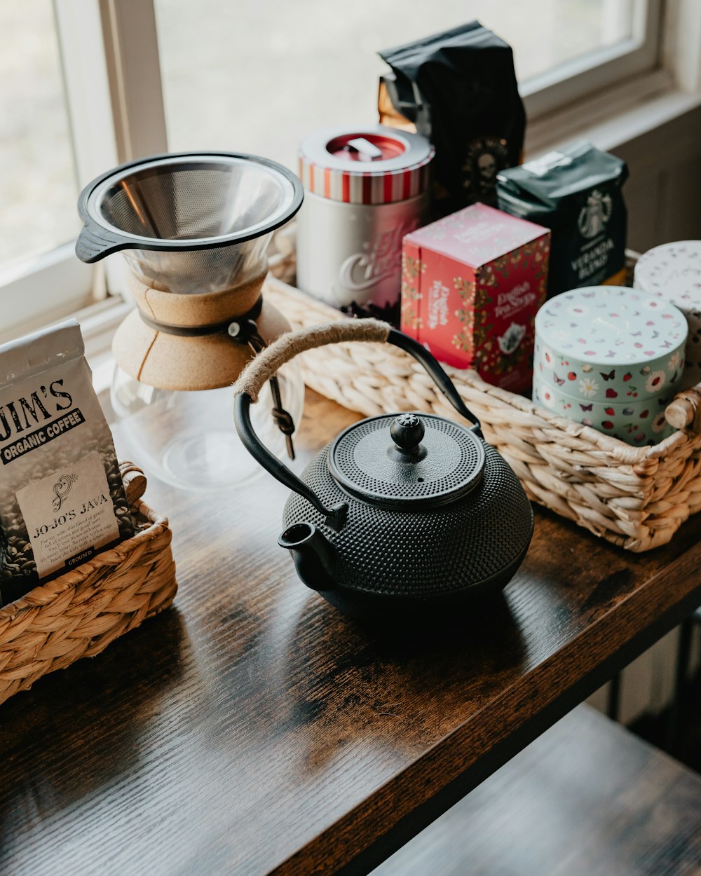 a tea pot sitting on top of a wooden table