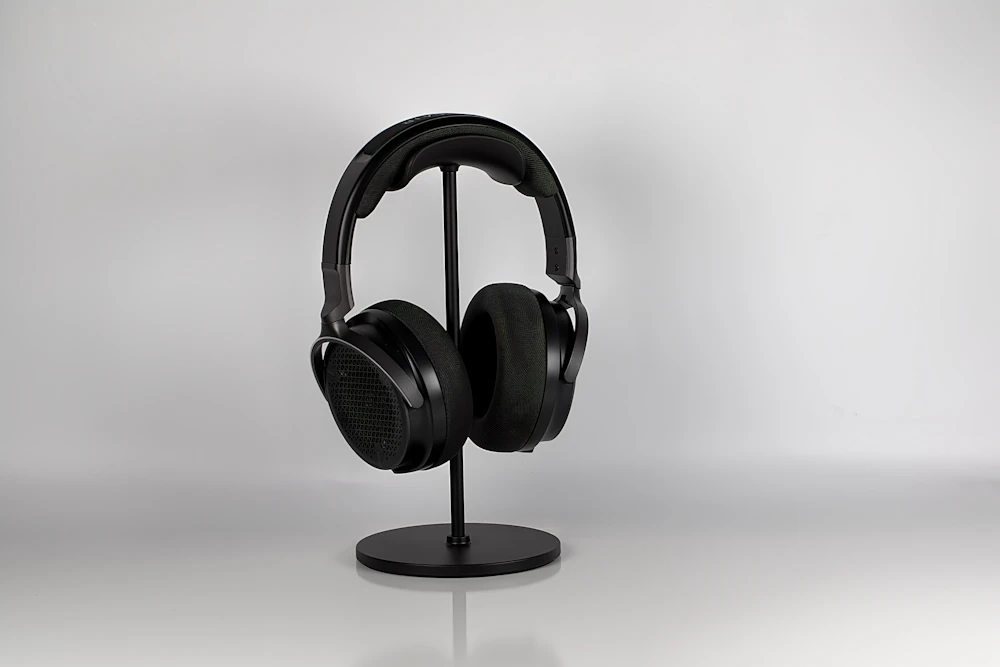 Headphones displayed on a minimalist stand