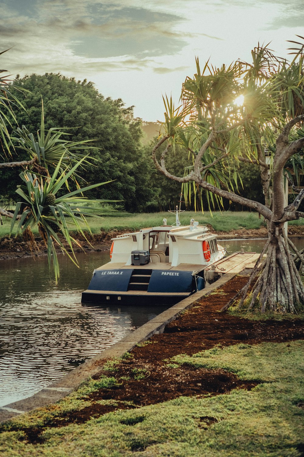 a boat is docked at the edge of the water