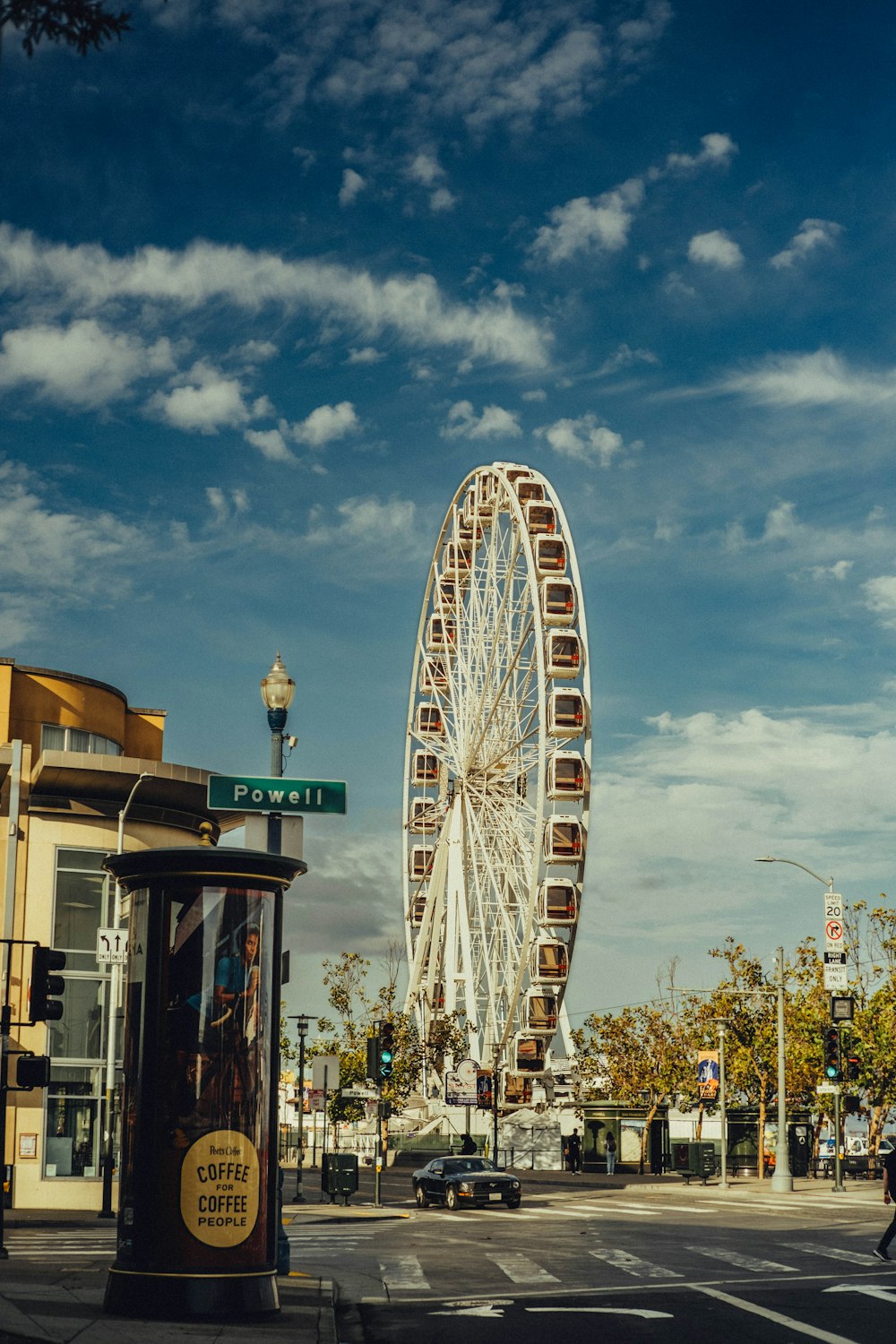 a large ferris wheel on a city street