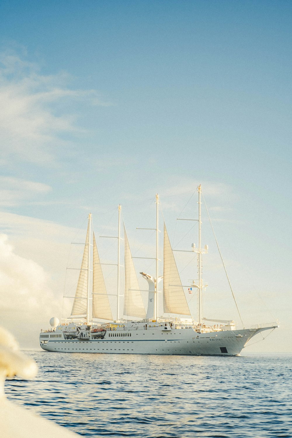 a large white boat floating on top of a body of water