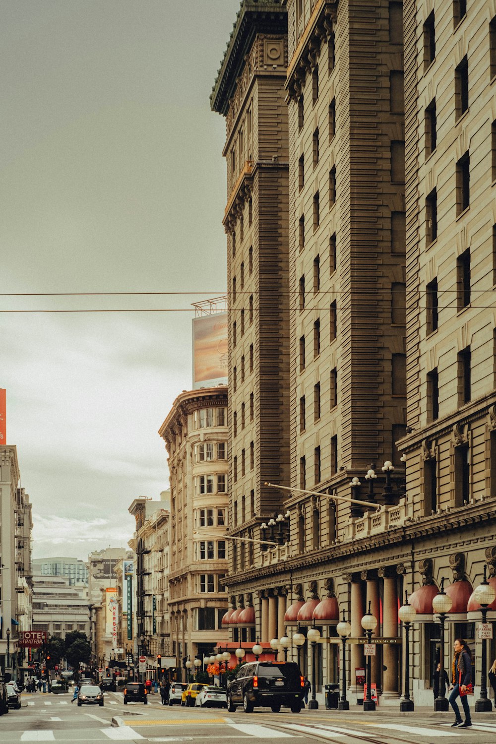 a city street filled with traffic and tall buildings