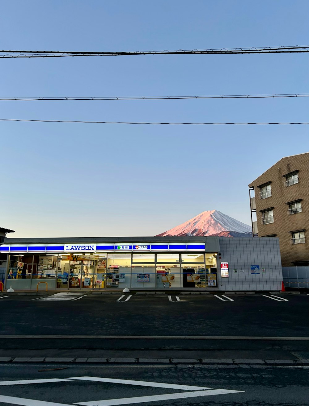 a gas station with a mountain in the background