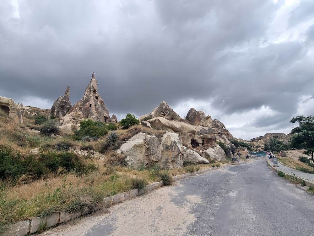 a road with a bunch of rocks on the side of it