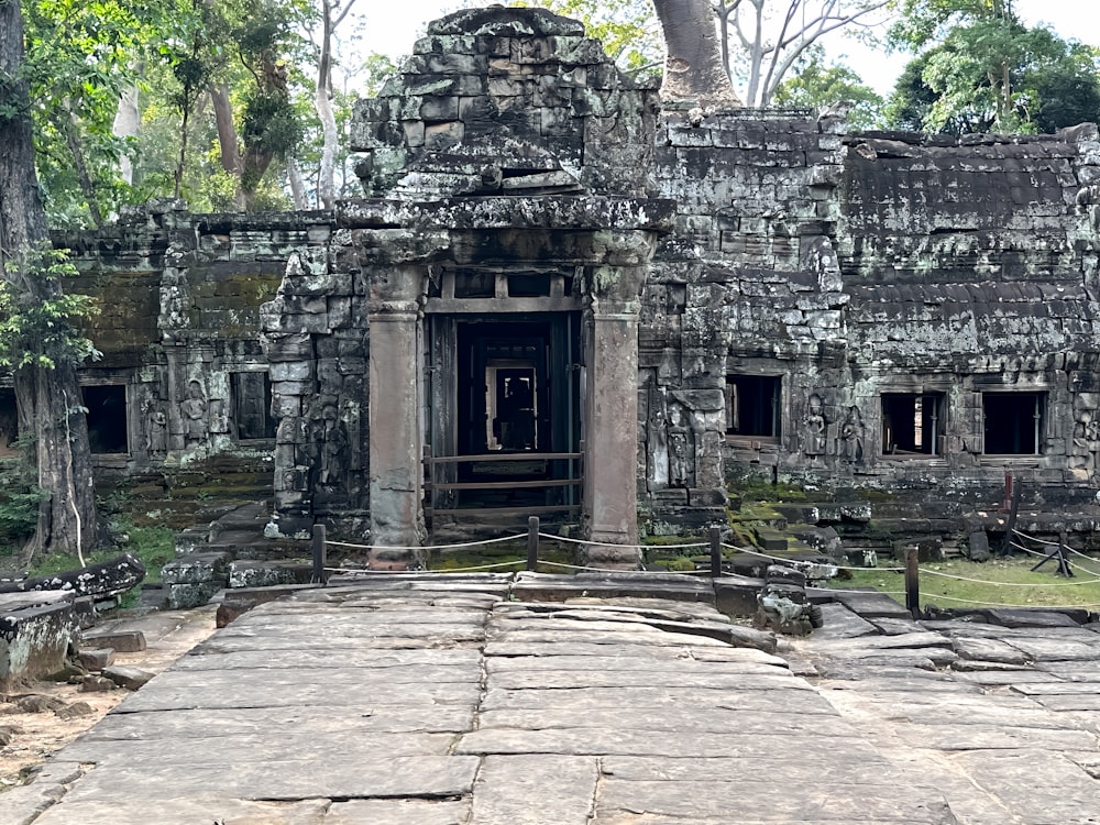 a stone building with a doorway in the middle of it