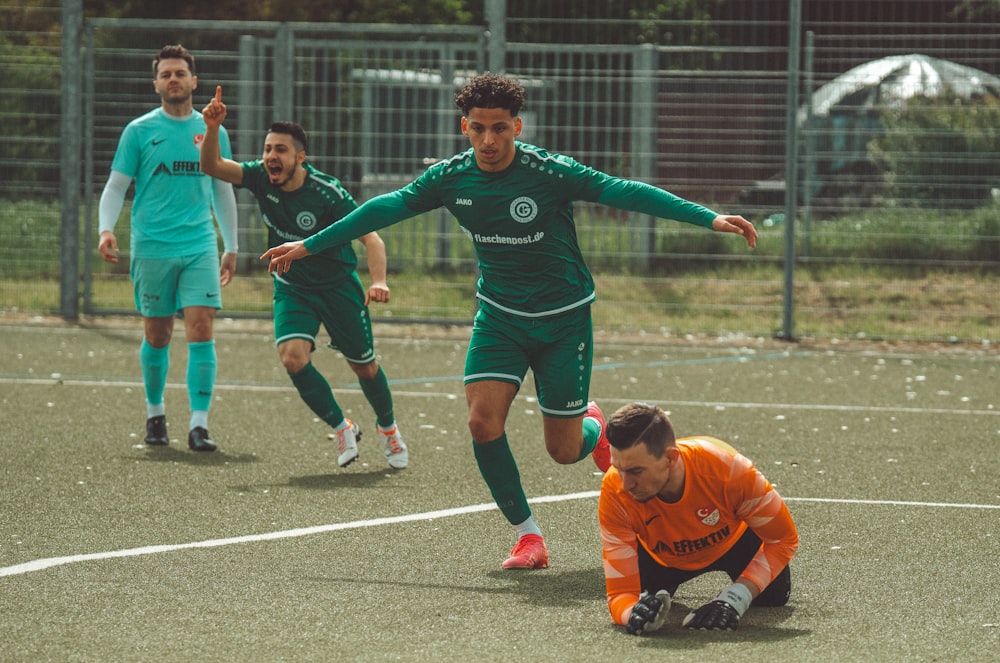 a group of young men playing a game of soccer