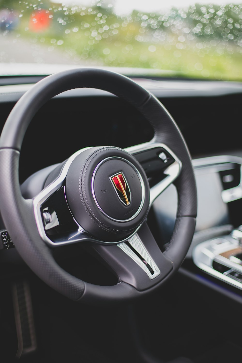 a steering wheel and dashboard of a car