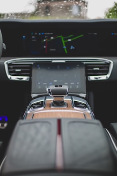 the dashboard of a car with a clock on it