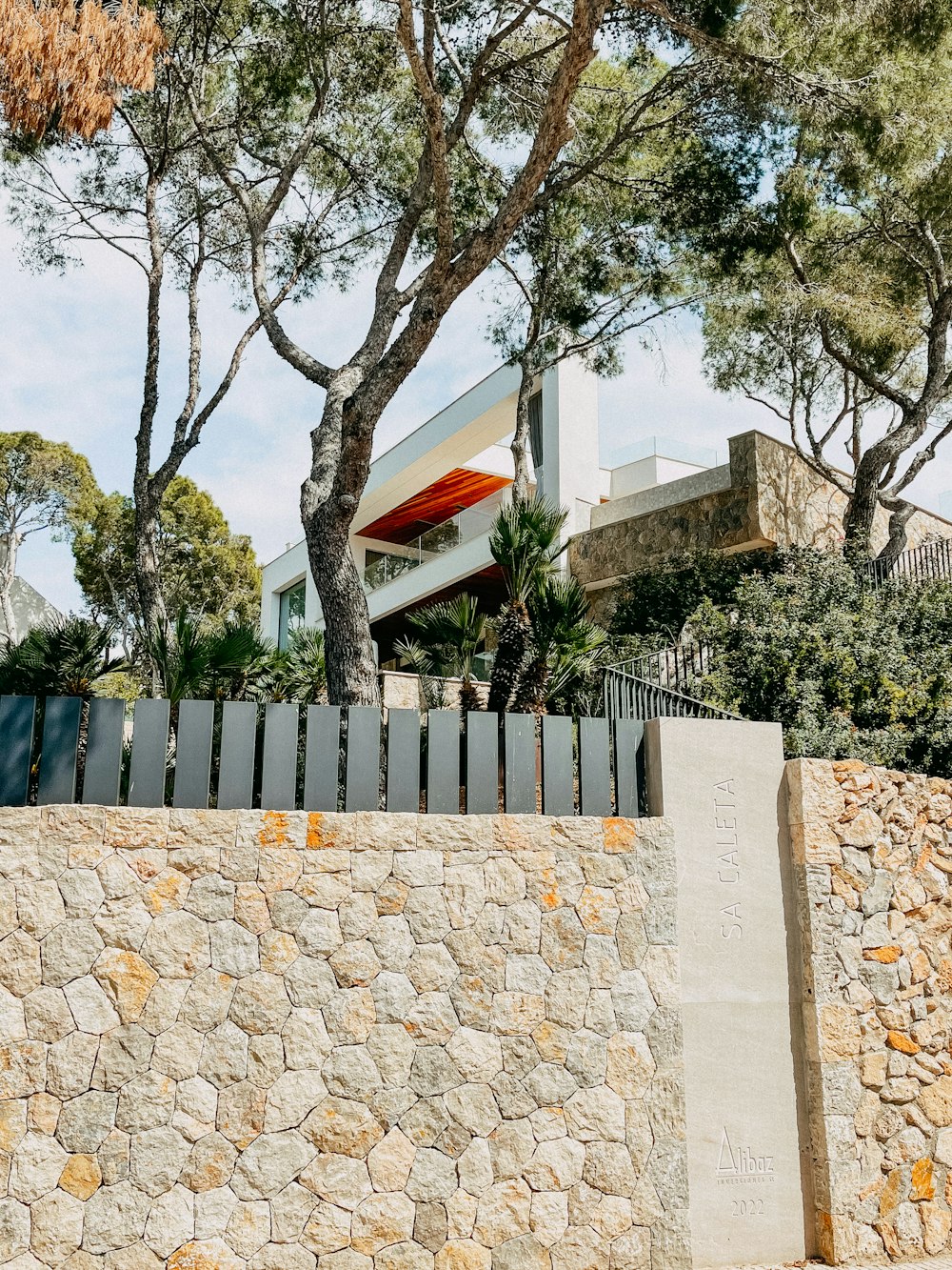 a man riding a skateboard down a stone wall