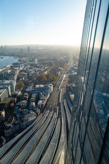 an aerial view of a city with a train on the tracks
