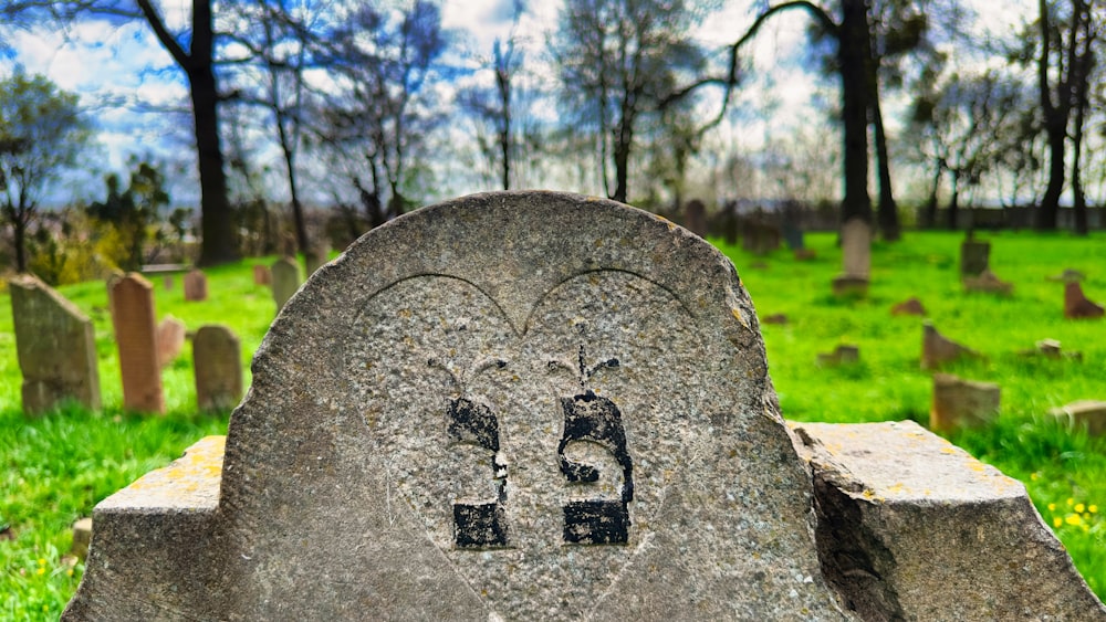 a headstone with a heart carved into it