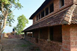 a brick building with a tree in front of it