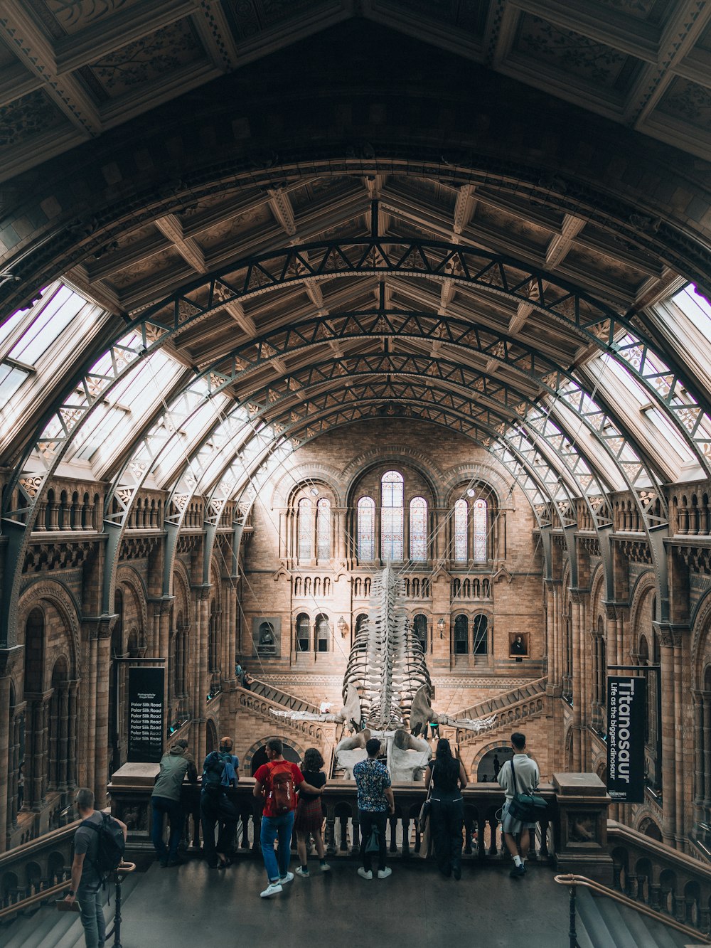 a group of people standing in a large building