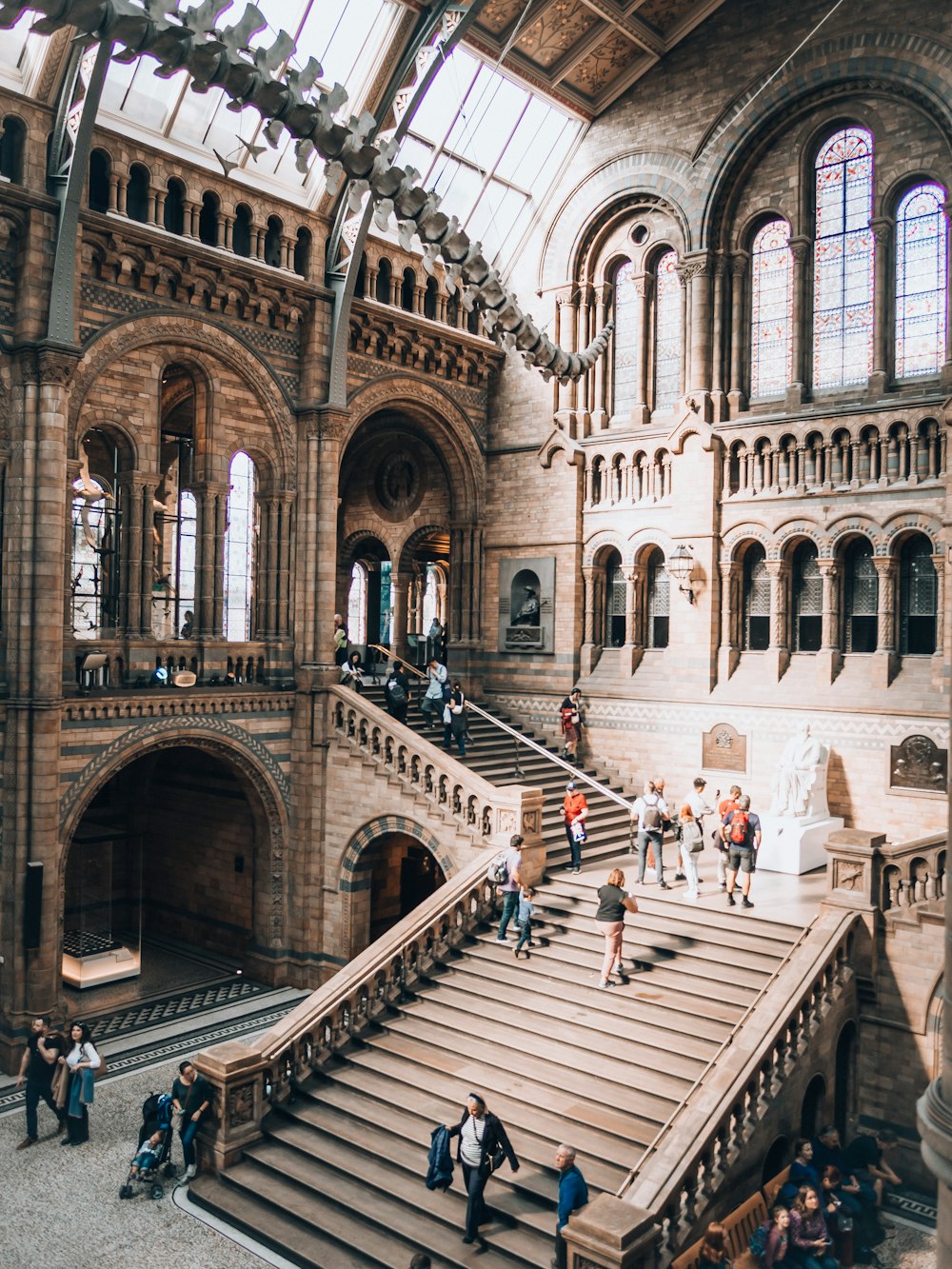 a group of people walking up and down some stairs