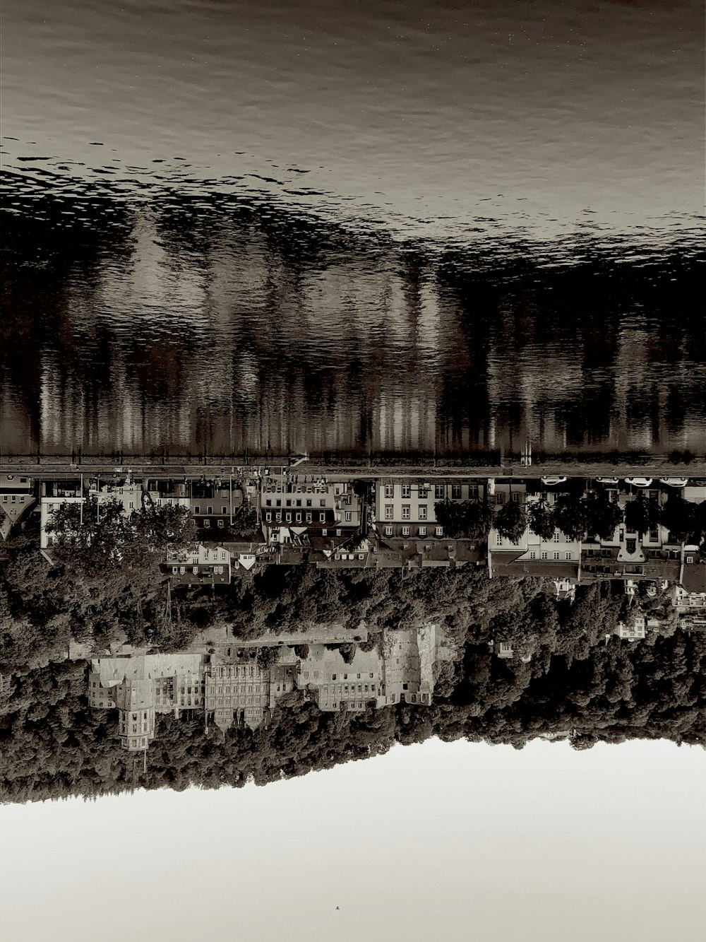 a black and white photo of a city under water