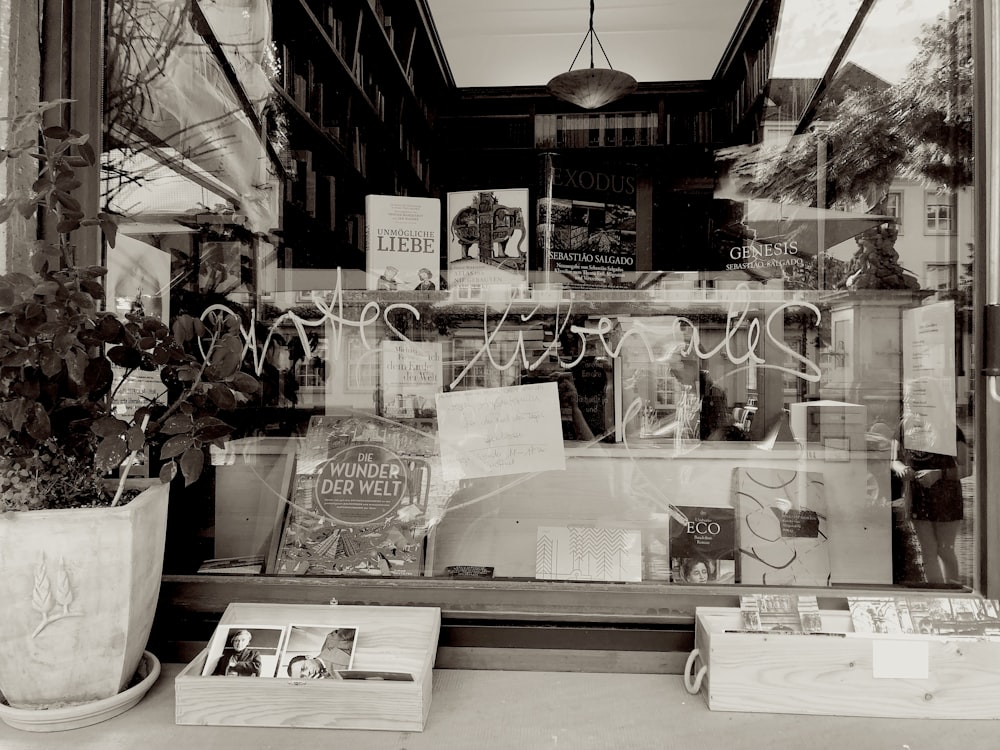 a black and white photo of a store window