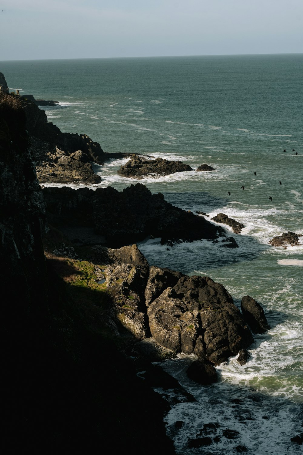 a view of the ocean from a cliff