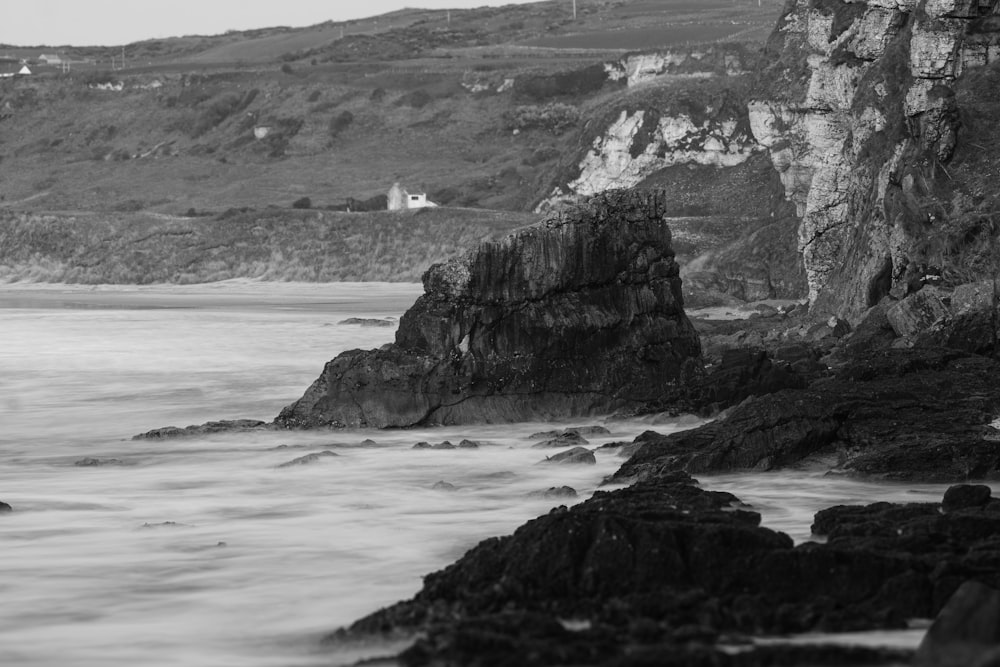 a black and white photo of a rocky beach