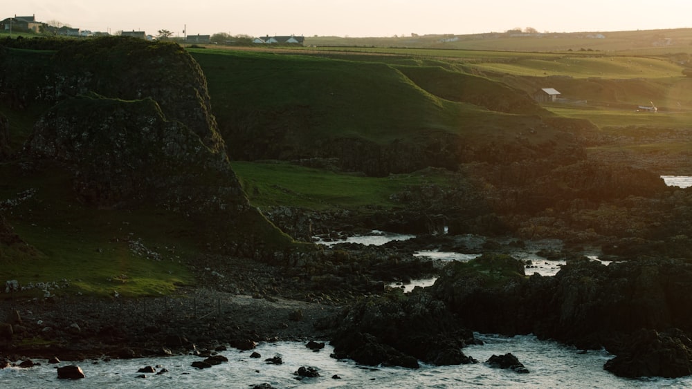 a river running through a lush green countryside