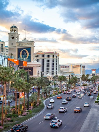 A busy city street lined with tall buildings, reflecting the density growth planned for downtown Las Vegas