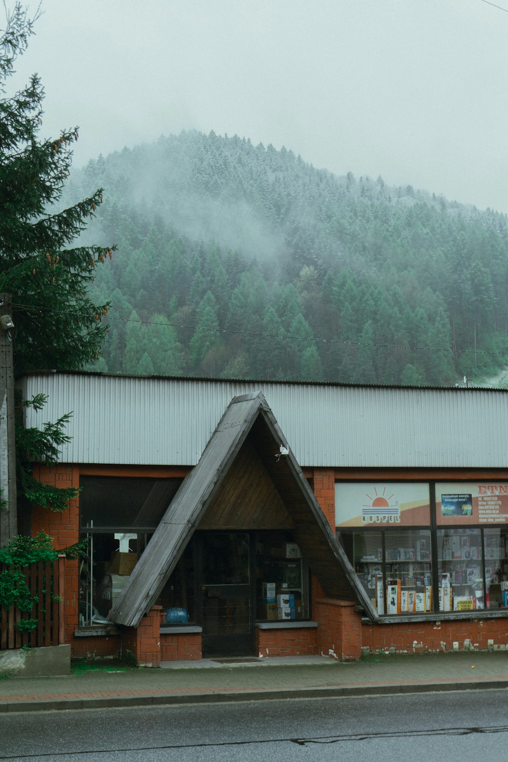 a building with a mountain in the background