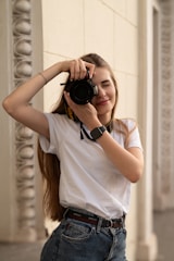 a woman taking a picture of herself with a camera