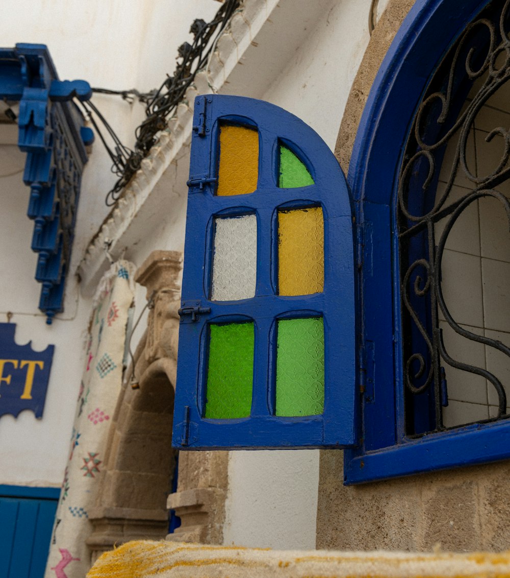 a close up of a window with a blue frame