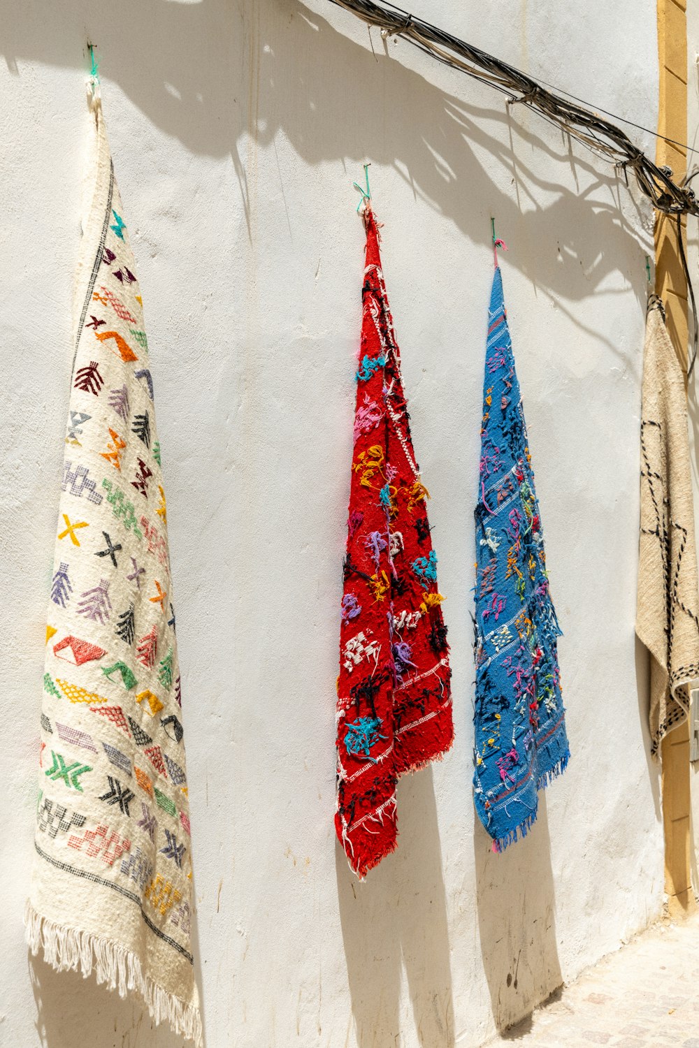 a group of towels hanging on a wall