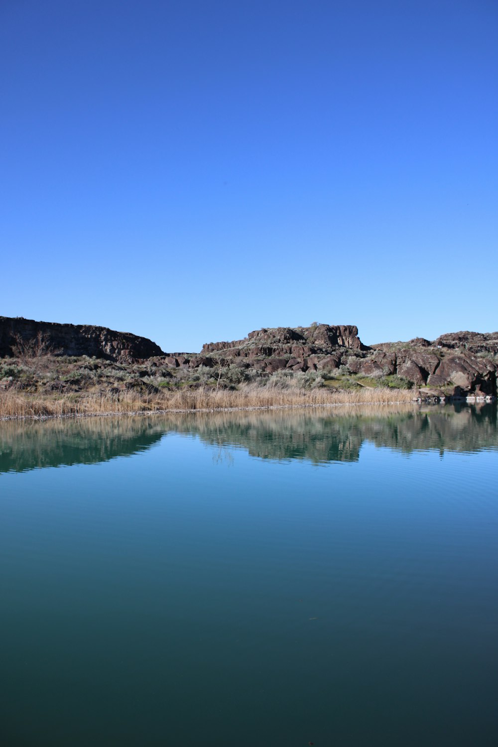 a large body of water surrounded by mountains