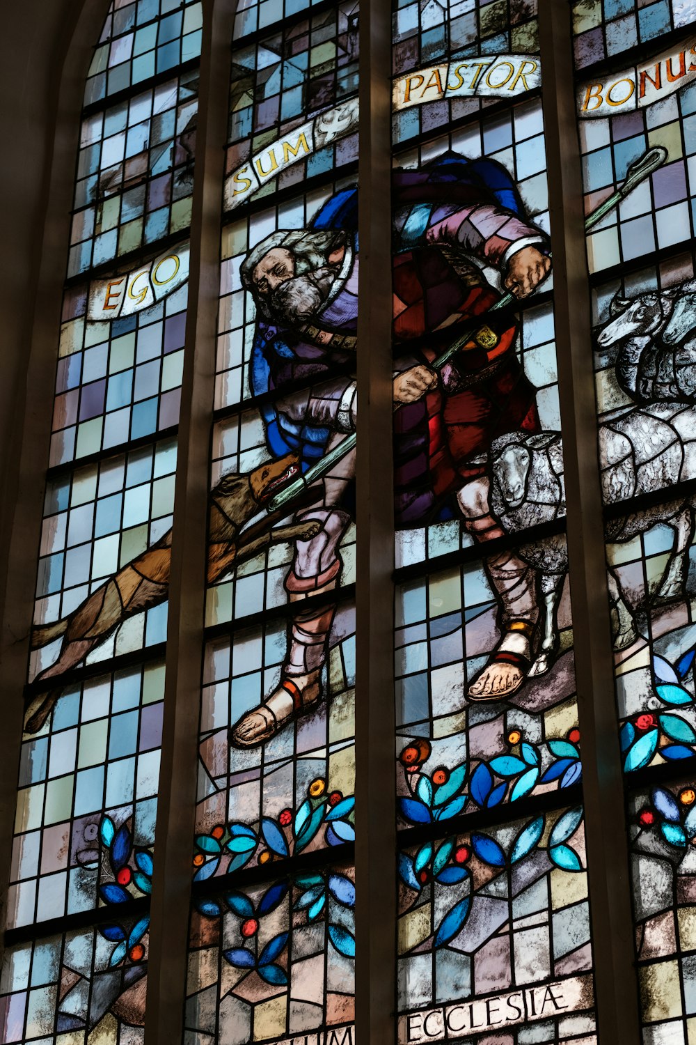 a stained glass window with a man on a horse