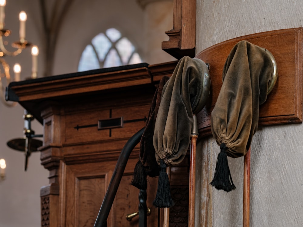 a coat rack with a pair of gloves hanging on it