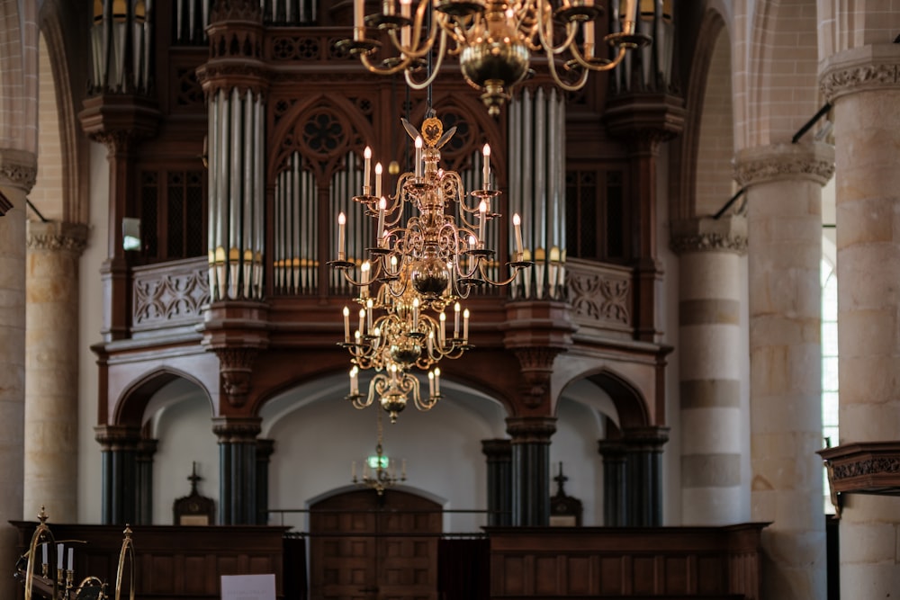 a chandelier hanging from the ceiling of a church