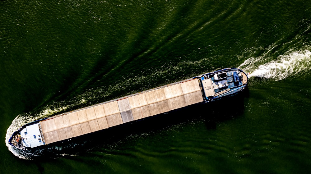 a small boat traveling through a body of water