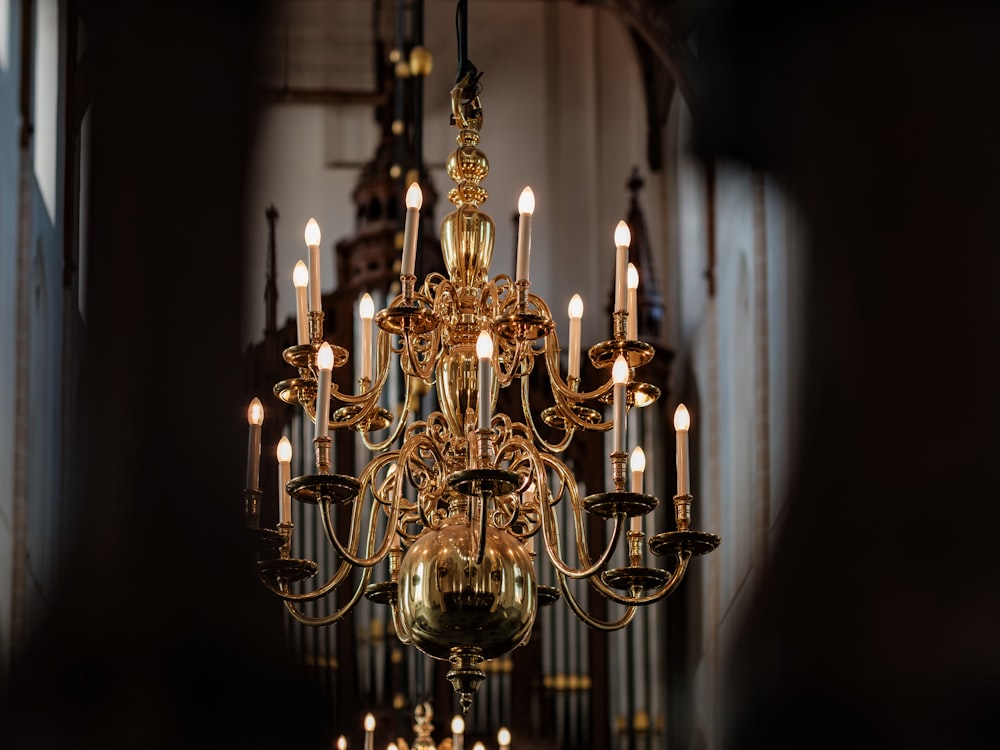 a chandelier hanging from the ceiling in a church