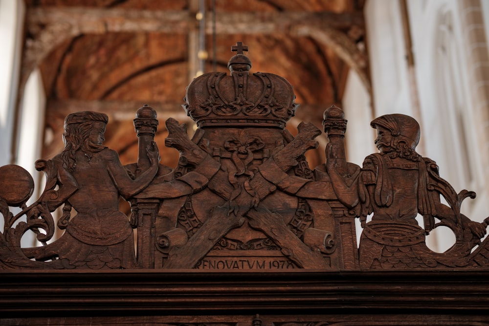 a wooden carving of a group of people