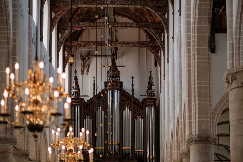 a church with a pipe organ and chandelier