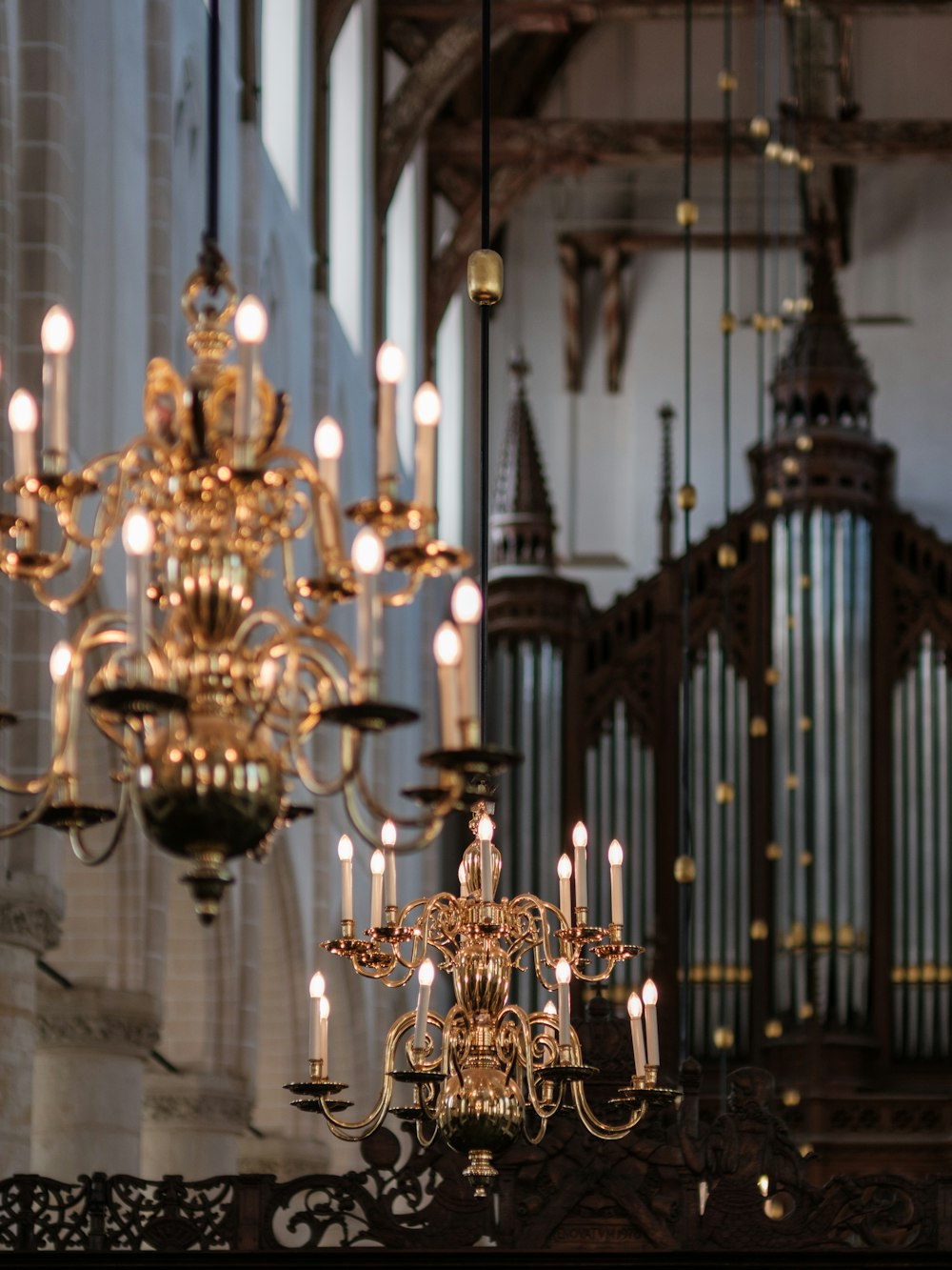 a chandelier hanging from the ceiling of a church