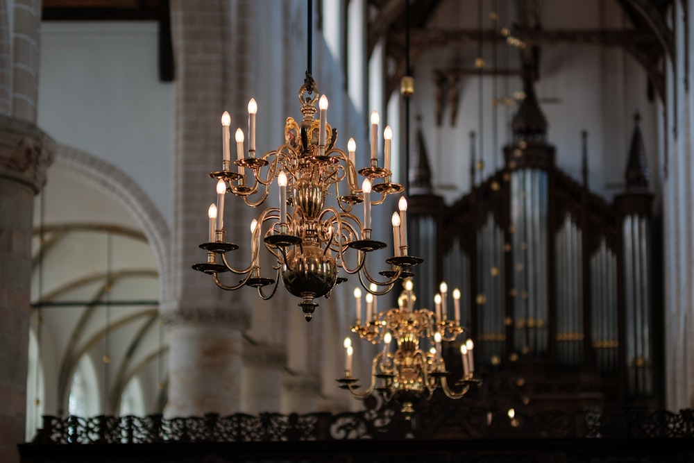 a chandelier hanging from the ceiling of a church