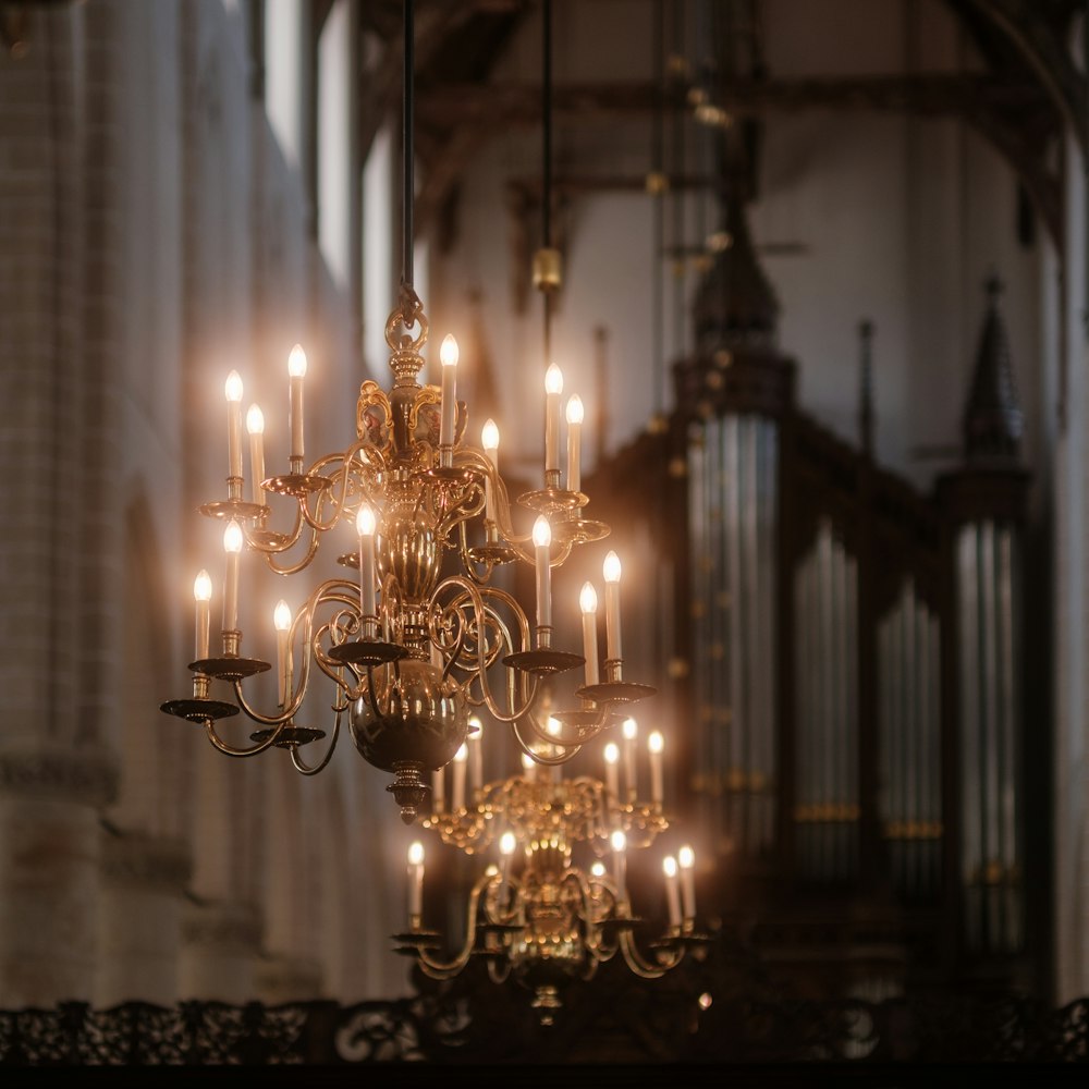 a chandelier hanging from a ceiling in a church