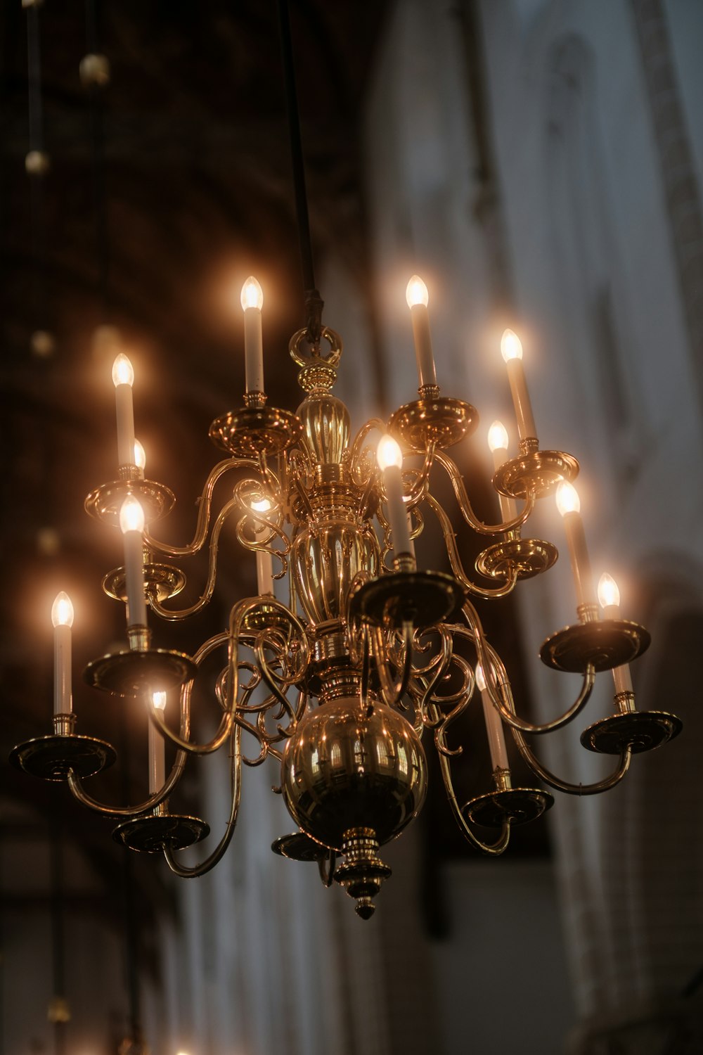 a chandelier hanging from a ceiling in a church